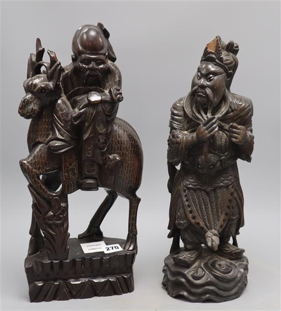 Two Chinese hardwood carvings of immortals, tallest 44cm